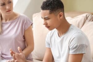 a teen in self-harm treatment emotes to a counselor